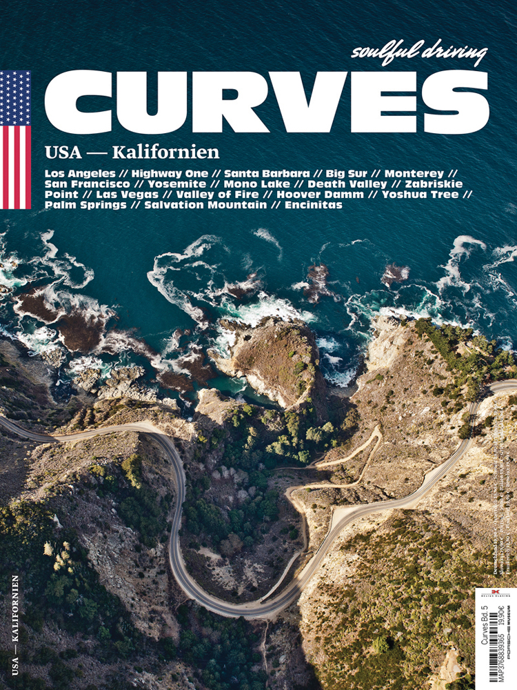 Aerial view of winding road in rocky mountain, near sea, on cover of 'Curves: USA - California', by Delius Klasing.