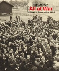Book cover of Ian Jeffrey's All At War: Photography by German soldiers 1939-45, with a large group of people standing at a station. Published by Ludion.