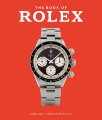 Book cover of Jens Joy's The Book of Rolex, with Paul Newman's silver Daytona Rolex watch. Published by ACC Art Books.