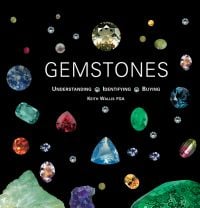 Arrangement of multi-colored gemstones on black cover of 'Gemstones ', by ACC Art Books.