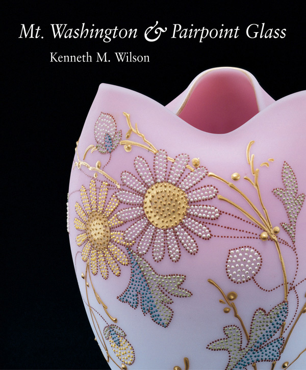 Pale pink frosted glass vase with floral design dotted on surface, on cover of 'Mt. Washington & Pairpoint Glass', by ACC Art Books.