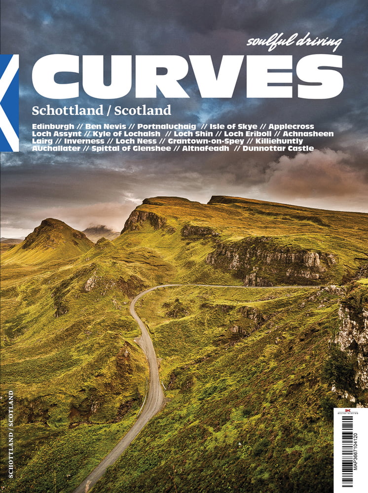 Hilly green landscape, with winding road, under moody sky, on cover of 'Curves Scotland, Number 8', by Delius Klasing.