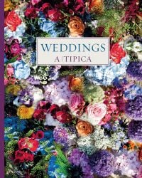 Pink roses, hydrangeas, dahlias and blue eryngium, on cover of 'Weddings A-Tipica', by Ediciones El Viso.