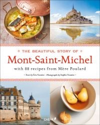Mont Saint-Michel under blue sky, two pears in bowl, scallop dish, on cover of 'The Beautiful Story of Mont-Saint-Michel', by Editions du Chene.