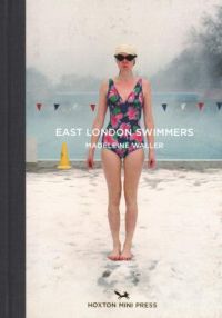 Book cover of Madeleine Waller's East London Swimmers, with swimmer in swimsuit, hat and goggles standing in front of swimming pool. Published by Hoxton Mini Press.