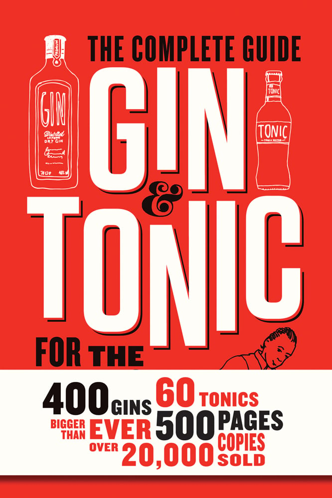 Two gin bottles on red cover of 'Gin and Tonic, The Complete Guide for the Perfect Mix', by Lannoo Publishers.