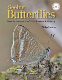 Book cover of Philip Howse's Seeing Butterflies: New Perspectives on Colour, Patterns & Mimicry, with a Long-tailed Blue butterfly. Published by Papadakis.