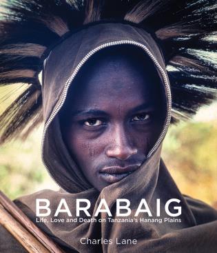 Barabaig tribesman, hair poking through hooded shawl, to cover of 'Barabaig', by River Books.
