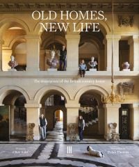 Book cover of Old Homes, New Life: The Resurgence of the British Country House, with a grand interior with arches, sculptured busts and a chandelier. Published by Triglyph Books.