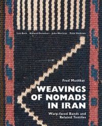 Black woven fabric with red and blue pattern to edges, on cover of 'Weavings of Nomads in Iran, Warp-faced Bands and Related Textiles', by Hali Publications.