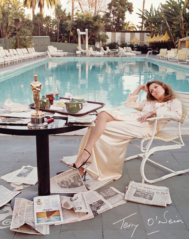 American actress Faye Dunaway takes breakfast by the pool with the day's newspapers at the Beverly Hills Hotel, on cover of 'Terry O’Neill: Every Picture Tells a Story', by ACC Art Books.