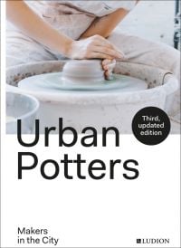 Book cover of Urban Potters: Makers in the City, with a potter shaping a piece of clay on a potters wheel. Published by Ludion.