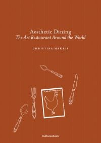 Rich brown cover with white illustrations of fork, knife, 2 spoons and a page with a chicken and Aesthetic Dining The Art Restaurant Around the World in white font
