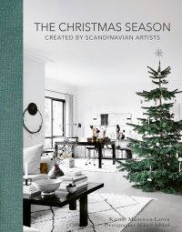 Nordic style white interior with green Christmas tree, on cover of 'The Christmas Season, Created By Scandinavian Artists', by ACC Art Books.