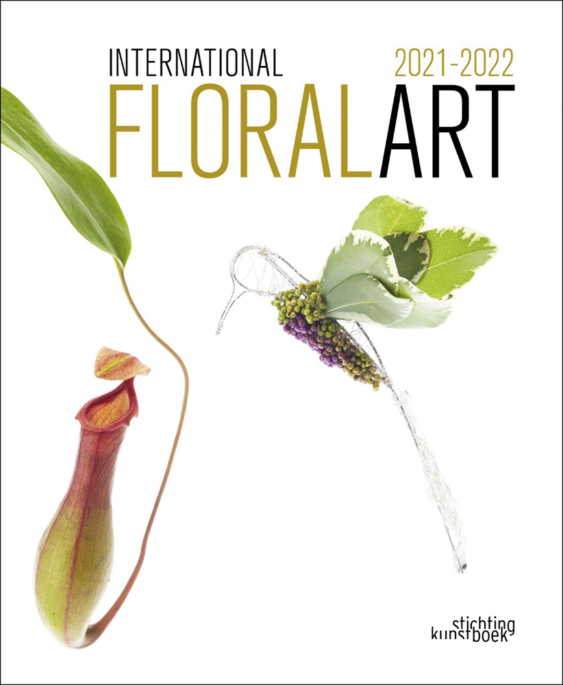 White book cover of International Floral Art 2021/2022, with carnivorous monkey cup plant and foliage made into hummingbird. Published by Stichting.