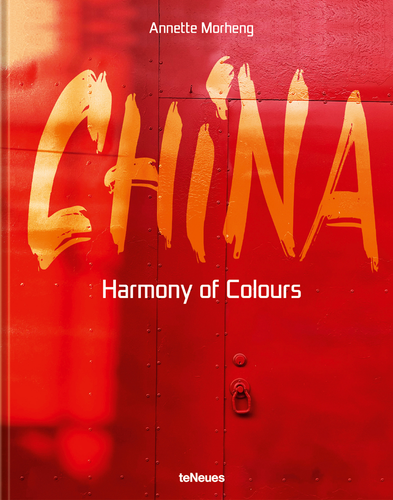 Large red steel door, CHINA, Harmony of Colors, in orange, and white font to centre.