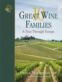 Stunning view of European vineyards with building in distance, on cover of '10 Great Wine Families, A Tour Through Europe' by Academie du Vin Library.