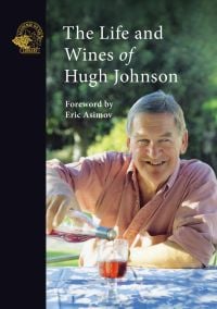 Hugh Johnson pouring a glass of rose wine, while smiling and looking to his left, on cover of 'The Life and Wines of Hugh Johnson', by Academie du Vin Library.