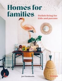 White interior space, with child's desk, toy telephone, flamingo wall mural, on cover of 'Homes for Families, Stylish living for kids and parents', by Lannoo Publishers.