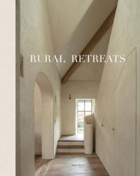 White interior hallway with archway, wood floor, on cover of 'Rural Retreats', by Beta-Plus.
