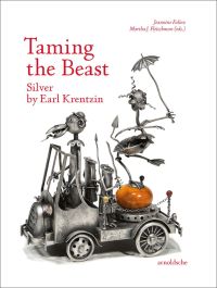 Silver sculpture of open roofed car with bird at wheel, creature balancing on orange egg to rear, on white cover of 'Taming the Beast Silver by Earl Krentzin', by Arnoldsche Art Publishers.