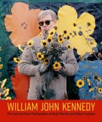Andy Warhol grasping bunch of yellow sunflowers, with bold flower backdrop, on cover of 'William John Kennedy ', by ACC Art Books.