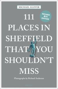 Statue holding hammer in one hand, near center of grey cover of '111 Places in Sheffield That You Shouldn't Miss', by Emons Verlag.