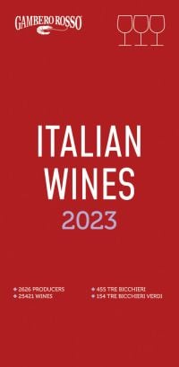 Three wine glasses to top right of red cover of 'Italian Wines 2023', by Gambero Rosso.