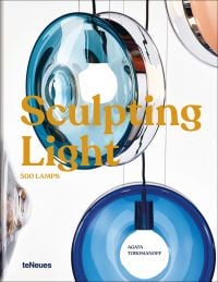 Blue glass lights suspended by wires, on cover of 'Sculpting Light', by teNeues Books.
