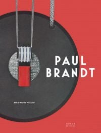 Red and grey pendant with diamond center, on red cover of 'Paul Brandt', by Editions Norma.