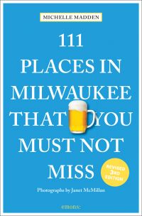 Glass tankard of beer near center of blue cover of '111 Places in Milwaukee That You Must Not Miss', by Emons Verlag.