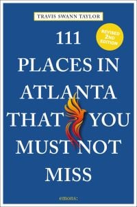 Orange and yellow Phoenix, near centre of blue cover of '111 Places in Atlanta That You Must Not Miss', by Emons Verlag.