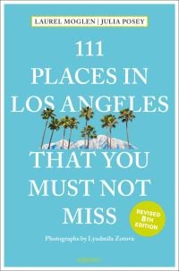 Row of palm trees with mountain behind, near center of turquoise cover of '111 Places in Los Angeles That You Must Not Miss', by Emons Verlag.