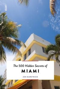 Art deco hotel with palm trees, on cover of 'The 500 Hidden Secrets of Miami', by Luster Publishing.