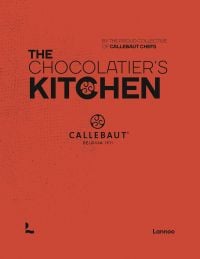 Orange book cover of 'The Chocolatier’s Kitchen, recipe book', by Lannoo Publishers.