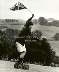Crispin Balfour rolling along at the Dangerous Sports Club tea party, 1981, on cover of 'ENGLAND: THE LAST HURRAH', by ACC Art Books.