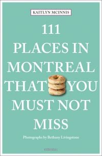 Guide book cover of '111 Places in Montreal That You Must Not Miss', with a stack of three sesame seed topped bagels. Published by Emons Verlag.