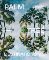 Idyllic travel location with palm trees bowing over water, on cover of 'Palm Tree Destinations, by Lannoo Publishers.