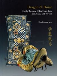 Chinese horse saddle with gold embroidered silk, navy rug behind, on cover of 'Dragon & Horse', by CA Book Publishing.