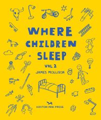 Book cover of James Mollison's Where Children Sleep Vol. 2, with metal framed bed surrounded by children's toys. Published by Hoxton Mini Press.