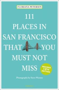 Golden Gate Bridge, to centre of mint green travel guide cover, '111 Places in San Francisco That You Must Not Miss' by Emons Verlag.