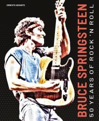 Guitarist on stage at Brendan Byrne Arena, wearing red bandana, on cover of 'Bruce Springsteen, 50 Years of Rock 'n' Roll', by White Star.