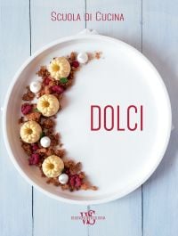 White plate with a dessert with raspberries arranged in a crescent shape to left side, on cover of 'Italian Cooking School: Dolci', by White Star.