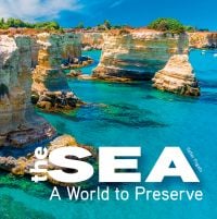 Book cover of The Sea, A World to Preserve, with Salento beach area with bright blue water and rocky coast. Published by White Star.