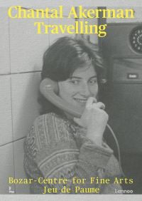 Book cover of Chantal Akerman: Travelling, with the artist smiling while holding a telephone. Published by Lannoo Publishers.