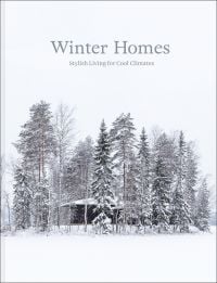 Book cover of Winter Homes: Stylish Living for Cool Climates, with a cabin obscured by snow-covered forest trees. Published by Images Publishing.