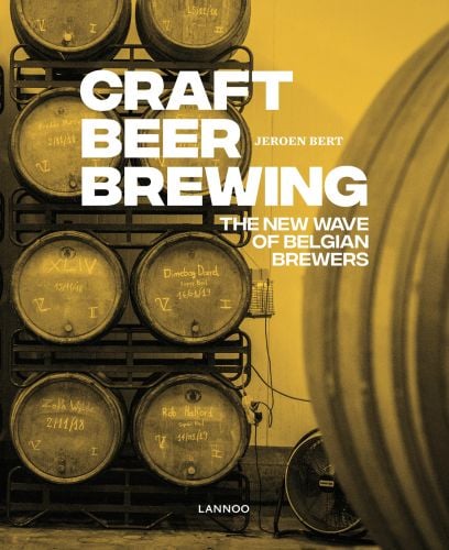 Beer brewing equipment with brewer, on cover of 'Craft Beer Brewing: The New Wave of Belgian Brewers', by Lannoo Publishers.