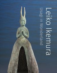 Book cover of Leiko Ikemura: Usagi in Wonderland, with a bronze sculpture of figure with a horned headpiece. Published by Verlag Kettler