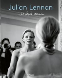 Book cover of Life's Fragile Moments: Julian Lennon, with Princess Charlene facing a mirror in her wedding dress. Published by teNeues Books.