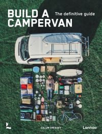 Book cover of Build a Campervan: The Definitive Guide, featuring an aerial view of a campervan with its contents laid out on the grass. Published by Lannoo Publishers.